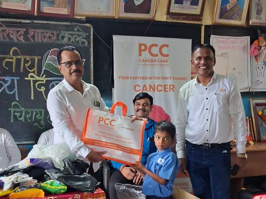 School student receiving a kit from the Oncourage outreach team